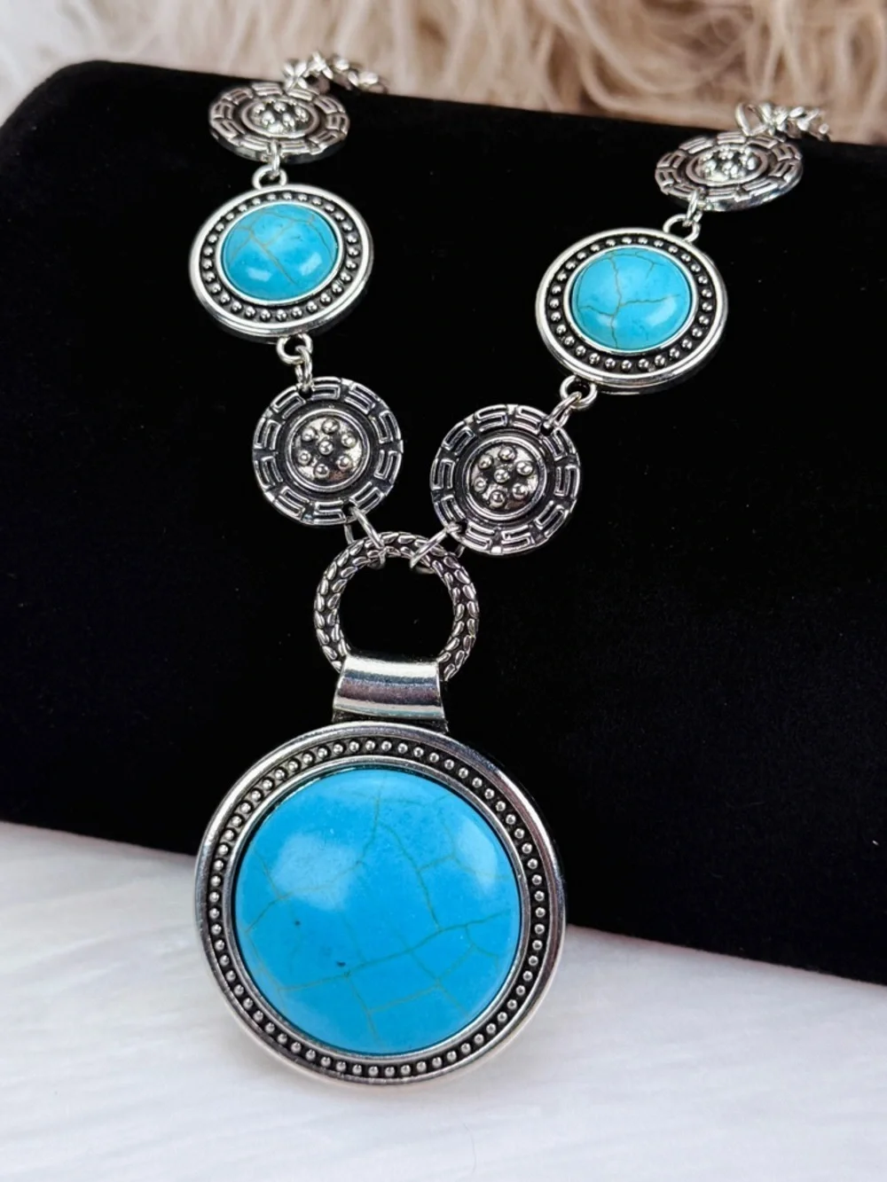 Silvertone, weighted southwestern style blue faux turquoise necklace